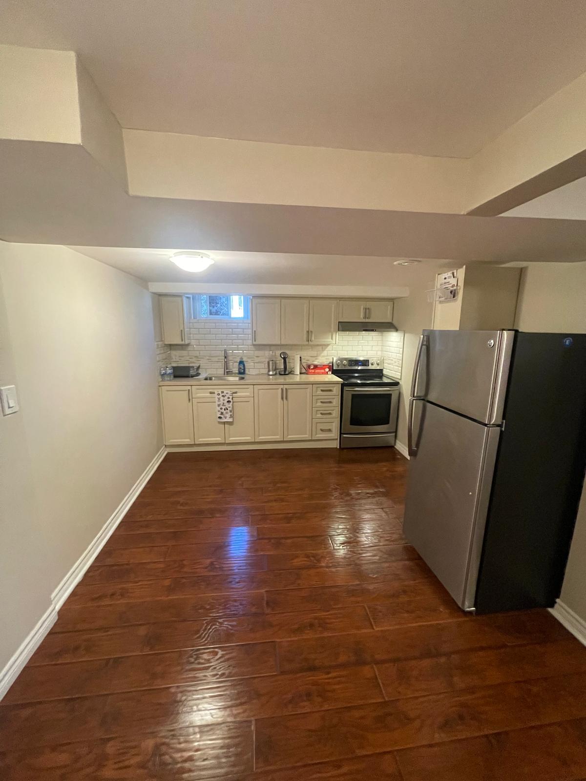 Renovated North York bungalow kitchen with island and quartz counters